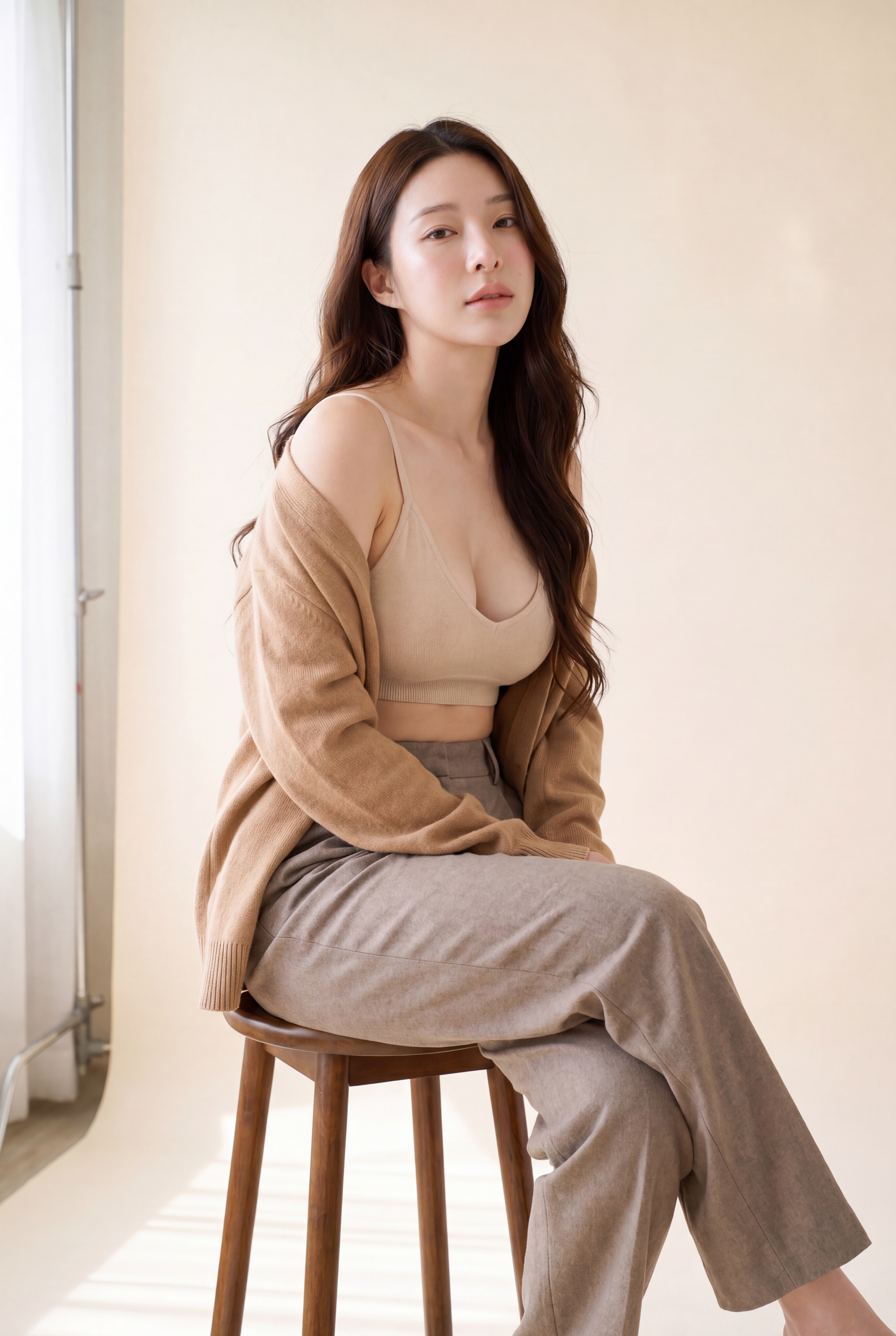 Mila — seated on stool, composed